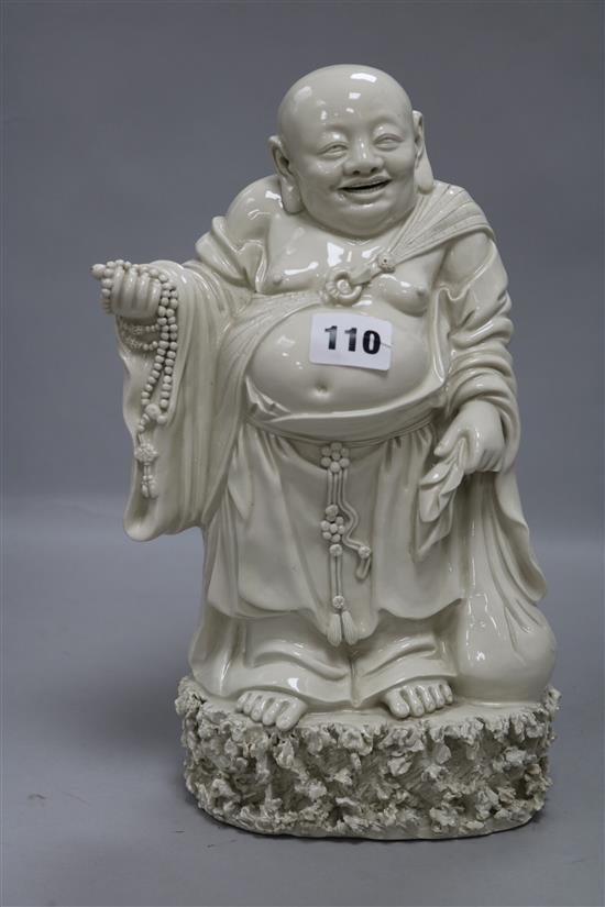 A Chinese blanc de chine figure of Budai